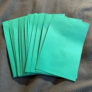 Lot of 21 new green envelopes. Just under 8 3/4” x 5 3/4”.